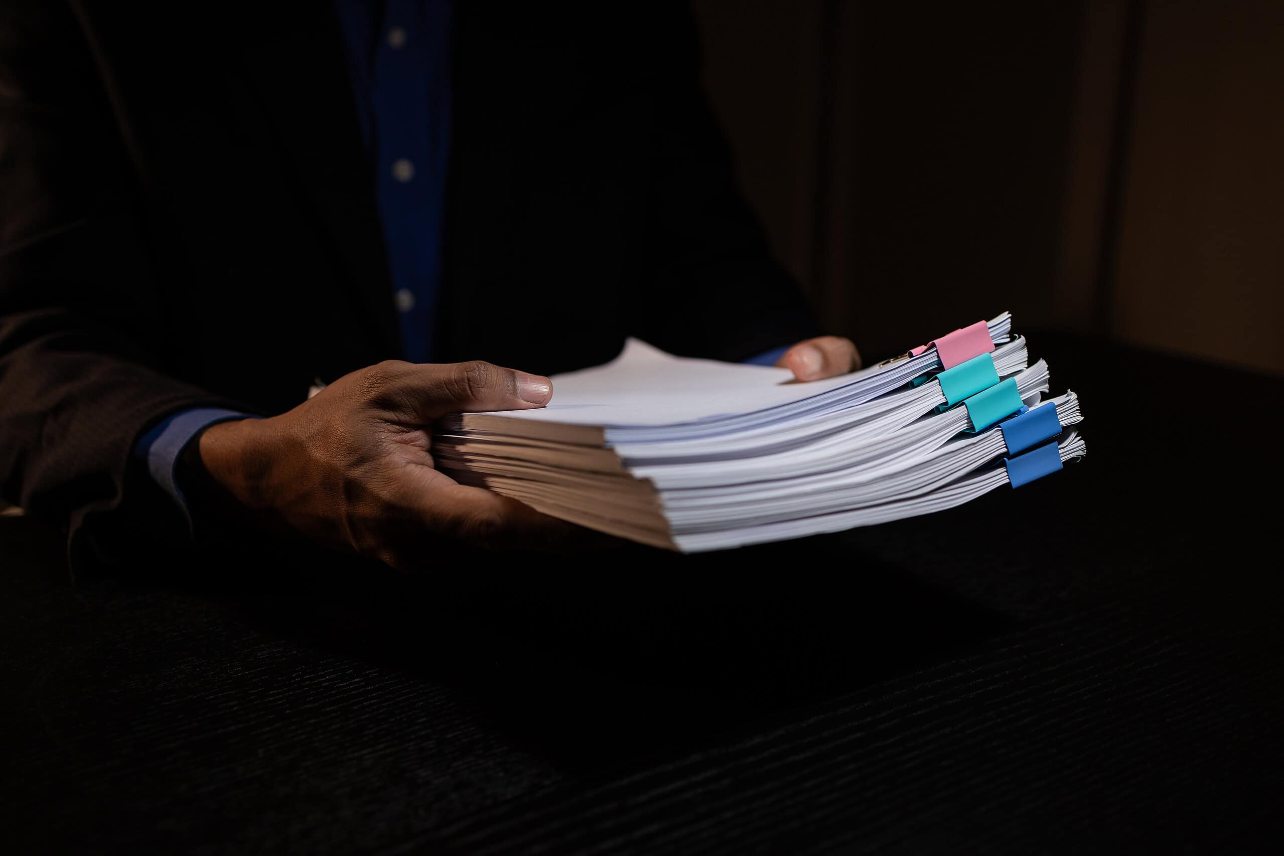 hands holding documents